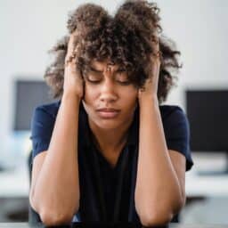 Woman with hearing loss experiencing listening fatigue